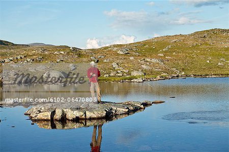 Man fly fishing in creek