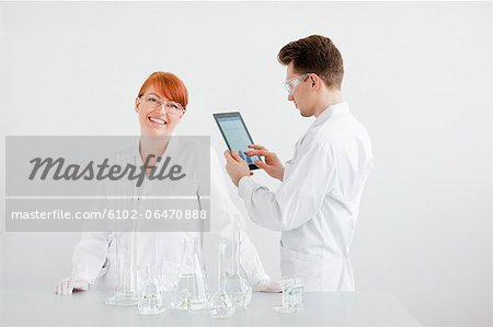 Two scientists working in laboratory