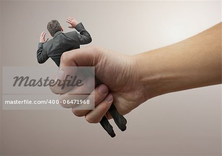 Squeezed  - A businessman being squeezed
