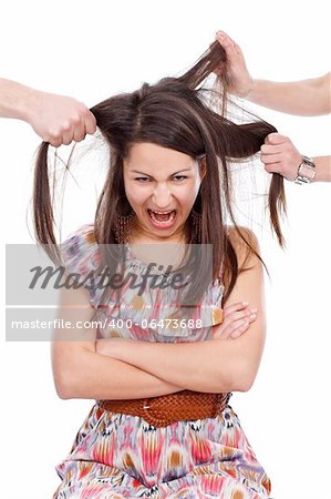 Frustrated teenager with hands pulling her hair