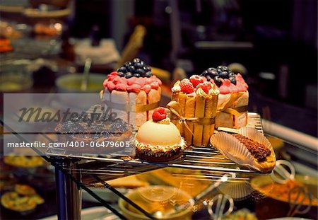 cakes and sweets in a shop window