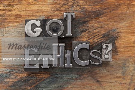 Got ethics question in vintage letterpress metal type on a grunge painted wood background