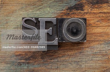 SEO (search engine optimization) acronym - vintage leterpress metal type blocks on a grunge painted wood