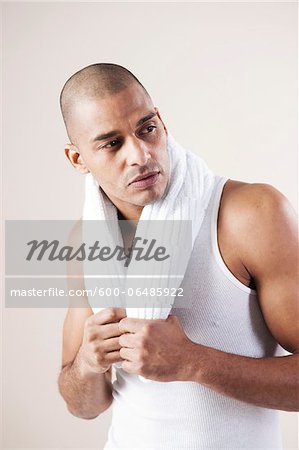 Man Wearing Work Out Clothes in Studio with White Background