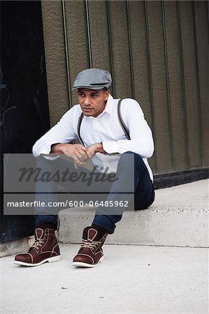 Portrait of Man Sitting on Step, Mannheim, Baden-Wurttemberg, Germany