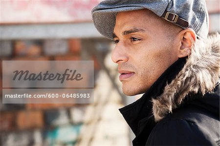 Portrait of Man Outdoors Wearing a Cap, Mannheim, Baden-Wurttemberg, Germany