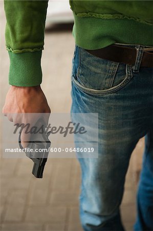 Close-up of Young Man holding Handgun, Mannheim, Baden-Wurttemberg, Germany