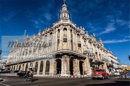Traffic Passing by Great Theatre of Havana (Gran Teatro de La Habana) with Bright Blue Sky, Havana, Cuba Traffic Passing by Great Theatre of Havana (Gran Teatro de La Habana) with Bright Blue Sky, Havana, Cuba