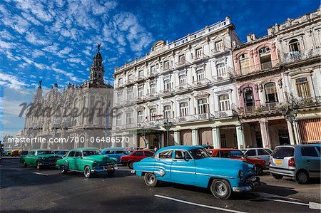 Classic Cars Driving by Great Theatre of Havana and Hotel Inglaterra, Havana, Cuba Classic Cars Driving by Great Theatre of Havana and Hotel Inglaterra, Havana, Cuba