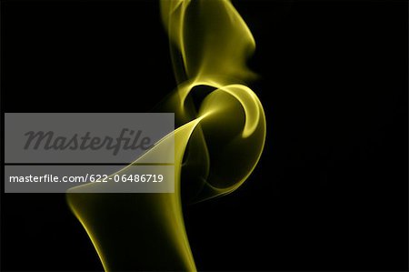 Yellow smoke on black background