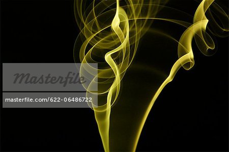 Yellow smoke on black background Yellow smoke on black background