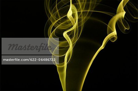 Yellow smoke on black background