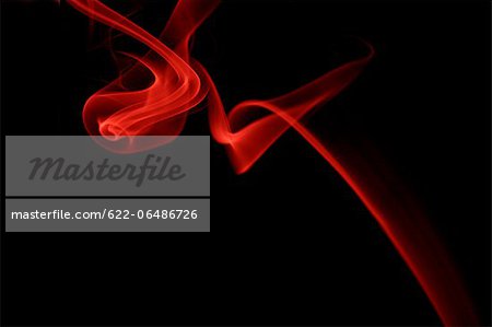 Red smoke on black background