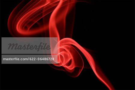 Red smoke on black background