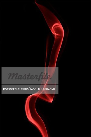 Red smoke on black background Red smoke on black background