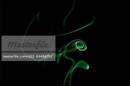 Green smoke on black background Green smoke on black background
