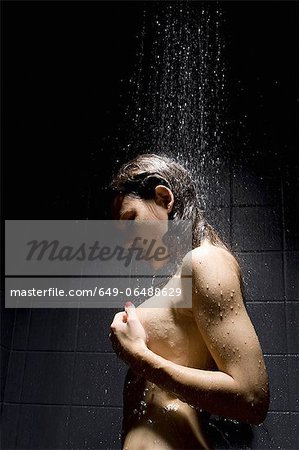 Woman washing herself in shower