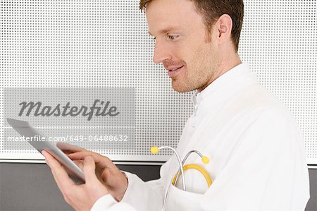 Doctor using tablet computer