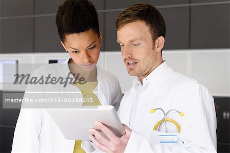 Doctor and patient with tablet computer