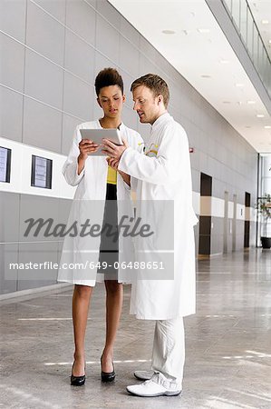 Doctors using tablet computer