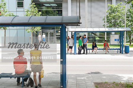 People waiting at bus stops