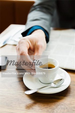 Businessman drinking cappuccino