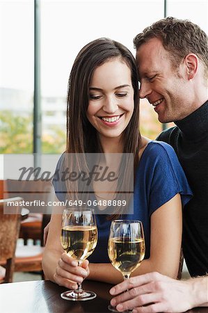 Couple drinking wine at cafe