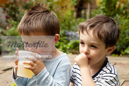 Boys relaxing in garden