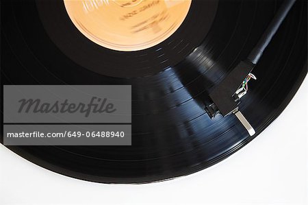 Close up of needle playing record Close up of needle playing record