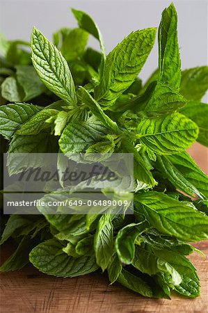 Sprig of mint on wooden board