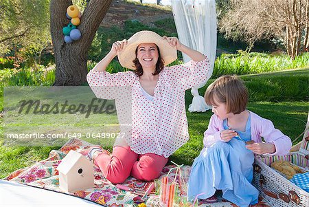 Mother and daughter having picnic