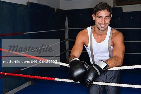 Smiling boxer standing in ring