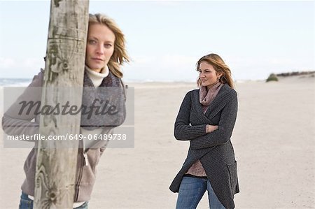 Women standing on beach