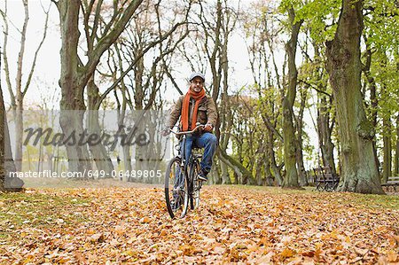 Man riding bicycle in park