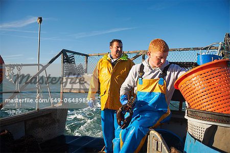 Fishermen at work on boat