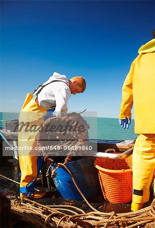 Fishermen at work on boat