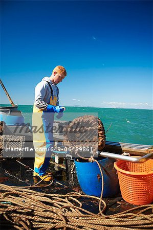 Fisherman at work on boat