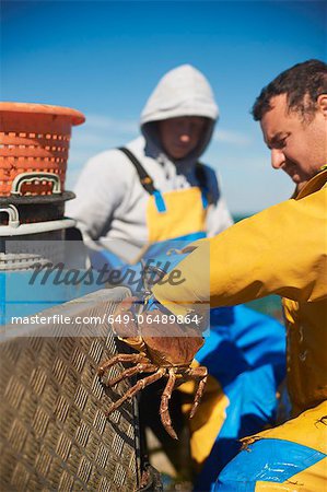 Fisherman at work on boat