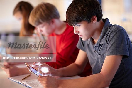 Students using tablet computers in class