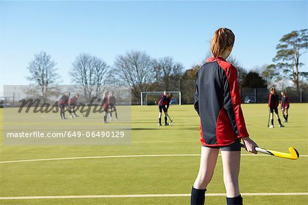 Lacrosse player standing in game