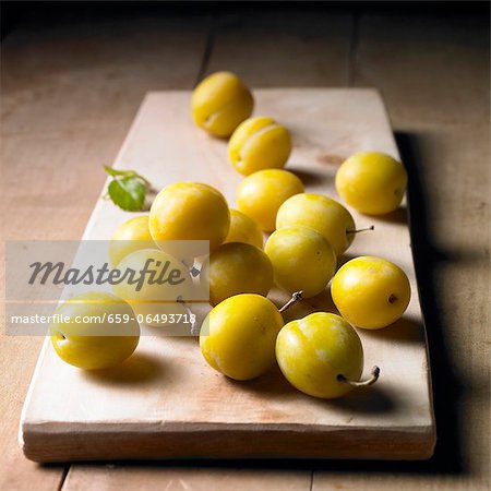 Mirabelles on a wooden board Mirabelles on a wooden board