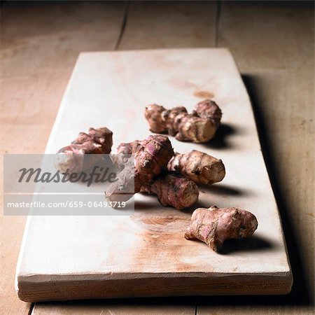 Jerusalem artichokes on a wooden board