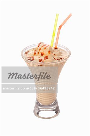 A caramel shake with two straws A caramel shake with two straws