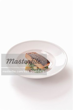 Salmon fillet on a bed of peas Salmon fillet on a bed of peas