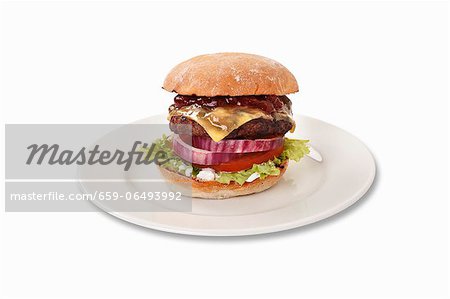 A cheeseburger with barbecue sauce