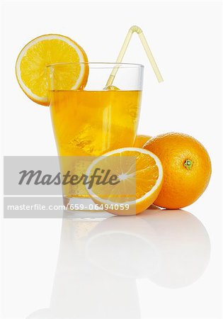 Orangeade and fresh oranges