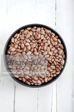 Dried pinto beans in a bowl Dried pinto beans in a bowl
