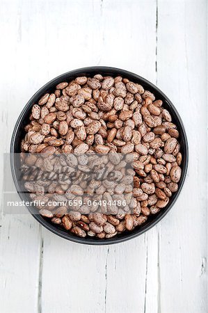 Dried pinto beans in a bowl