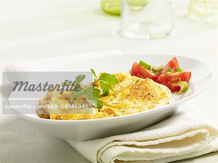 Scrambled egg with a tomato salad