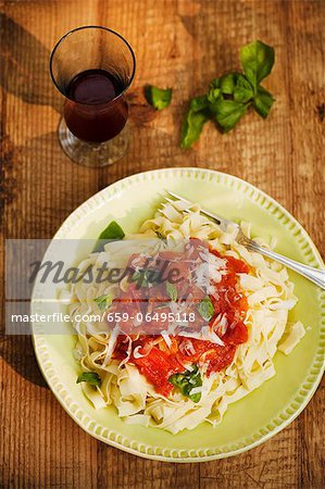 Pasta with Fresh Tomato Sauce, Basil and Parmesan Cheese; From Above Pasta with Fresh Tomato Sauce, Basil and Parmesan Cheese; From Above
